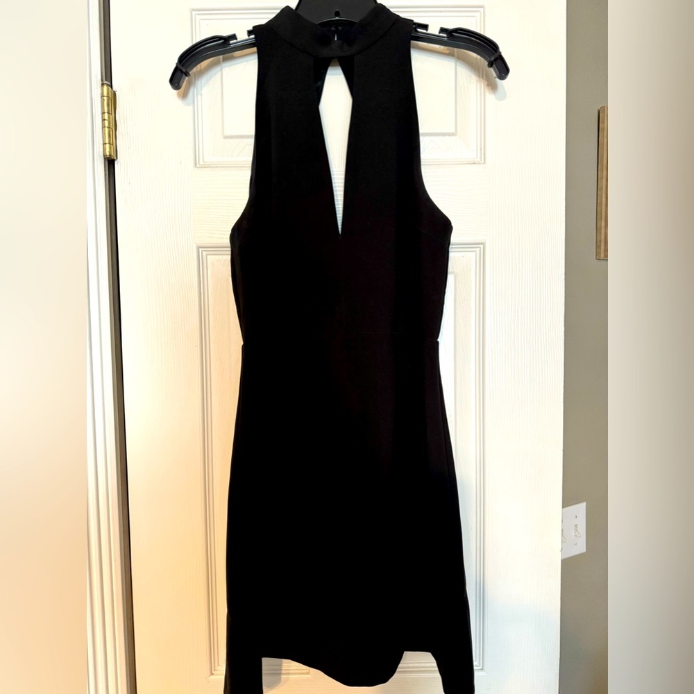 Express black mini dress. Rayon type material. Keyhole design. Lace back. Size 6